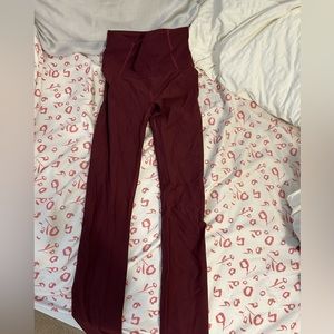 Lululemon Maroon Leggings! Little holes placed in front in back for design!